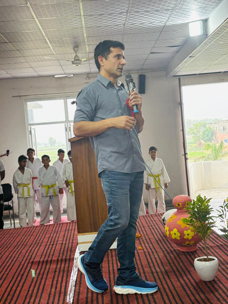 Coach Manjeet speaking at a school in India