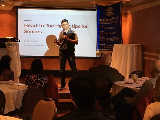 Coach Manjeet presenting head-to-toe health tips for seniors at Rotary